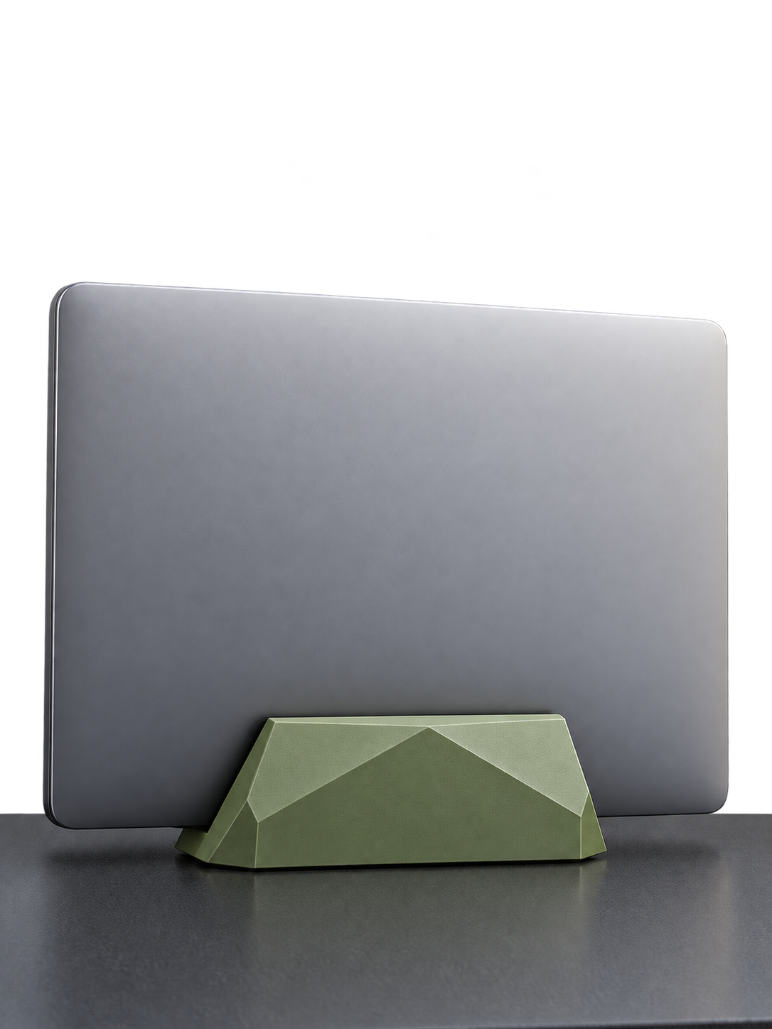 Closed silver laptop in an olive green geometric laptop stand